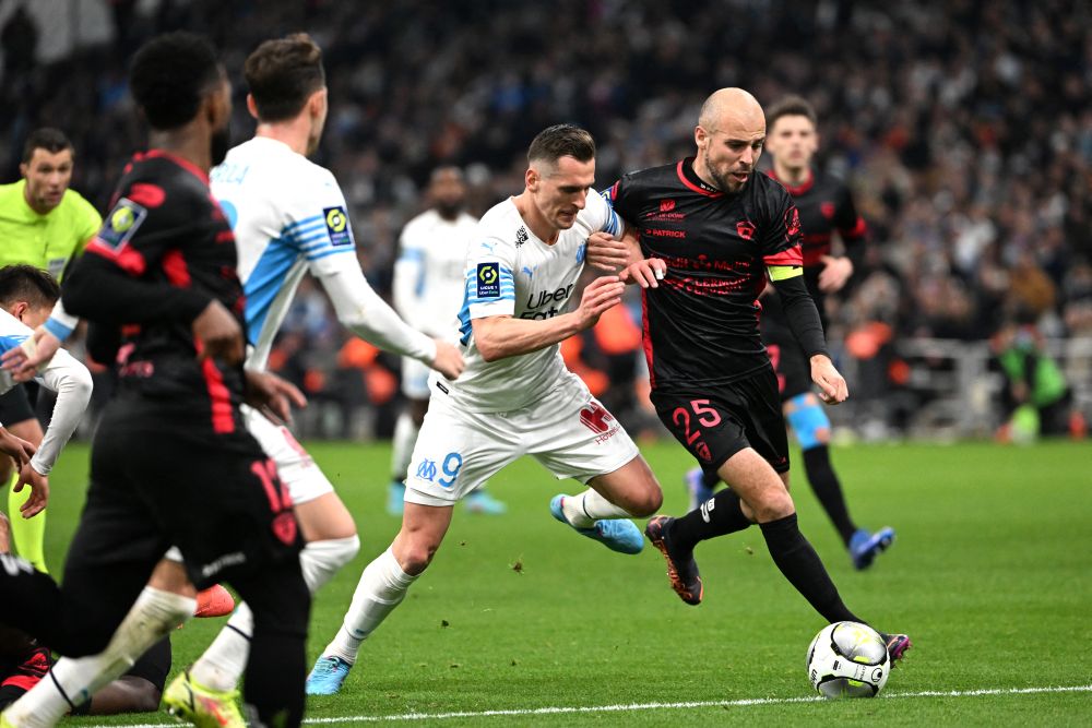 Marseille's Polish forward Arkadiusz Milik (centre)in action against Clermont's Johan Gastien at Stade Velodrome in Marseille February 20, 2022. u00e2u20acu201d Reuters pic