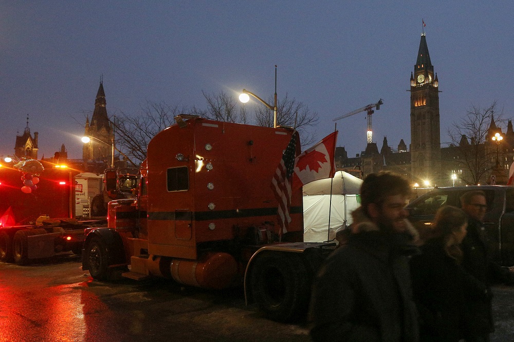 Peace tower on Parliament Hill is illuminated while truckers line the street as the protest against Covid-19 vaccine mandates continues, in Ottawa, Ontario, Canada February 9, 2022. u00e2u20acu2022 Reuters pic