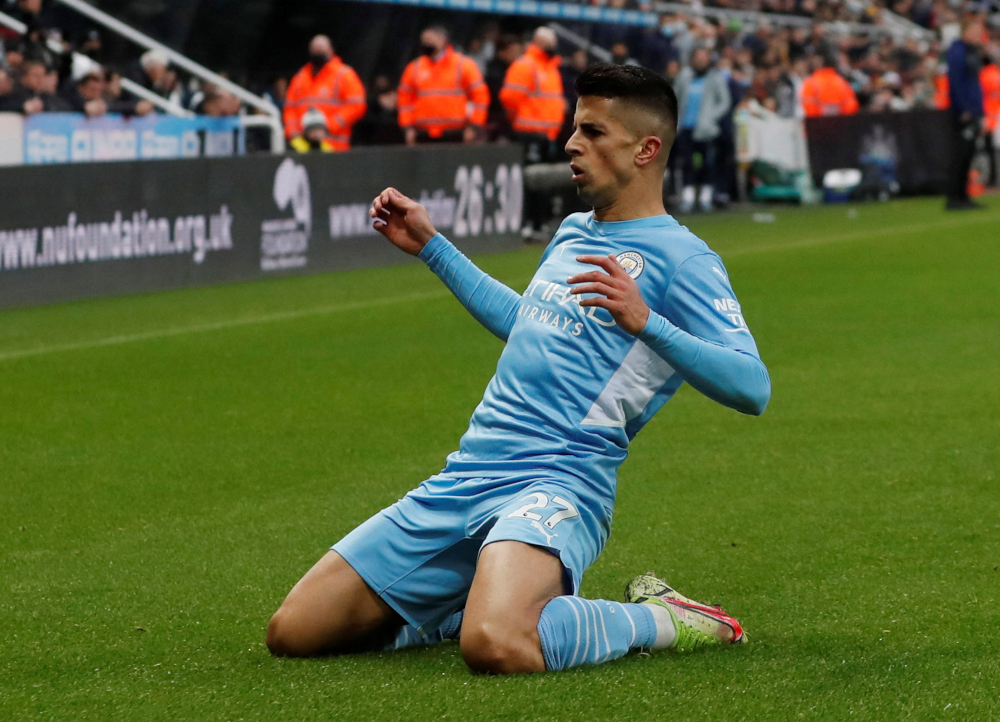 Manchester Cityu00e2u20acu2122s Joao Cancelo celebrates scoring their second goal against Newcastle United at St Jamesu00e2u20acu2122 Park in Newcastle, December 19, 2021. u00e2u20acu201d Action Images pic via Reuters