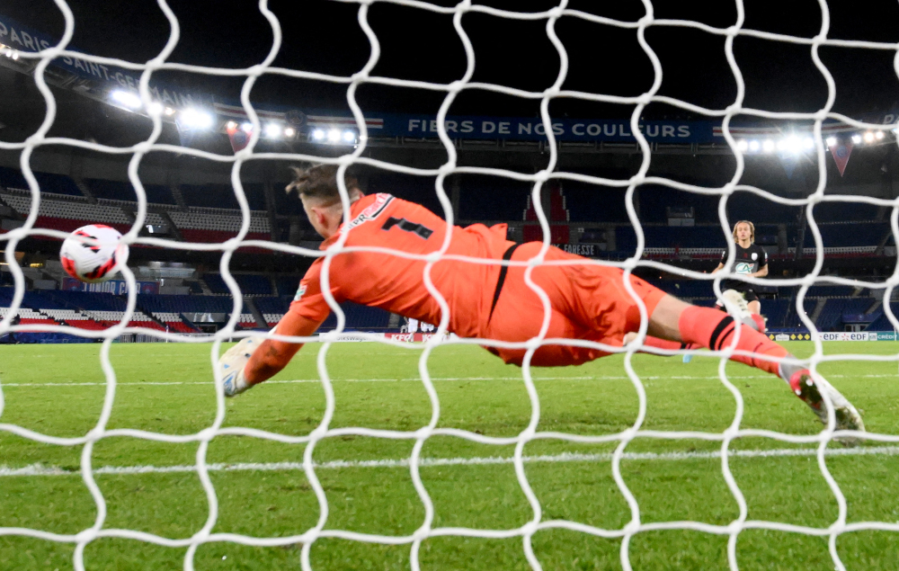Niceu00e2u20acu2122s Polish goalkeeper Marcin Bulka stops Paris Saint-Germainu00e2u20acu2122s Dutch midfielder Xavi Simonsu00e2u20acu2122 shot during the penalty shootout of the French Cup match at the Parc des Princes stadium in Paris, January 31, 2022. u00e2u20acu201d AFP picn
