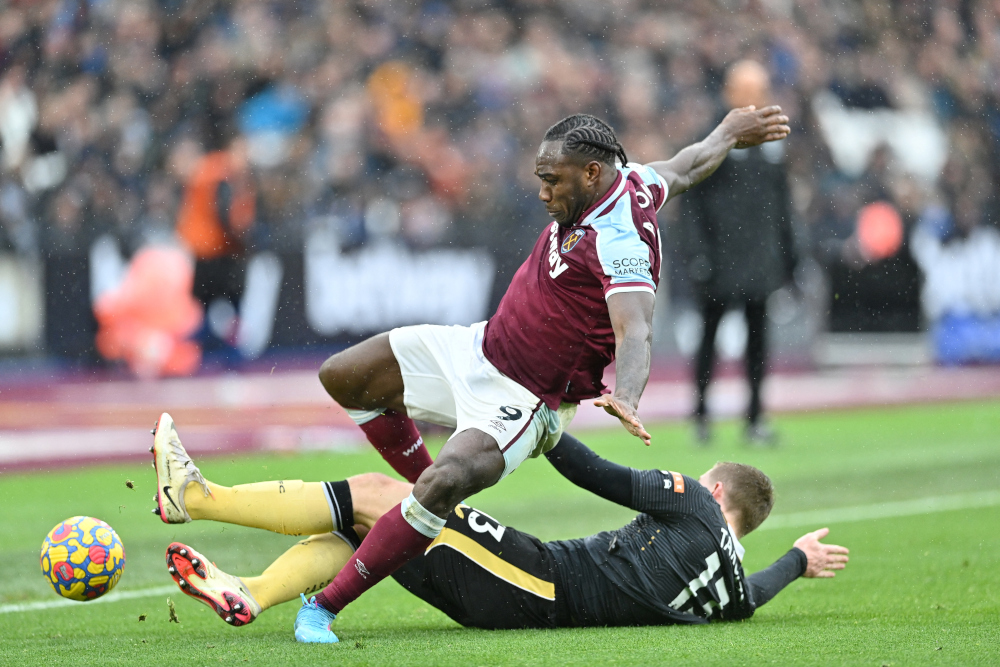 West Ham United midfielder Michail Antonio fights for the ball with Newcastle United defender Matt Targett during the English Premier League match at the London Stadium, in London on February 19, 2022. u00e2u20acu2022 AFP pic 