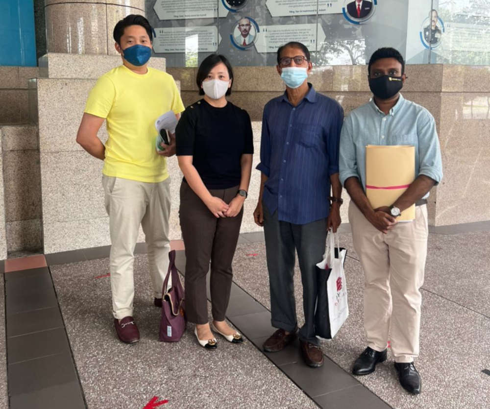Mohamed Khairuzzaman (2nd R) is pictured with his lawyers outside the Immigration Department headquarters in Putrajaya. u00e2u20acu201d Picture courtesy of Ngeow Chow Ying