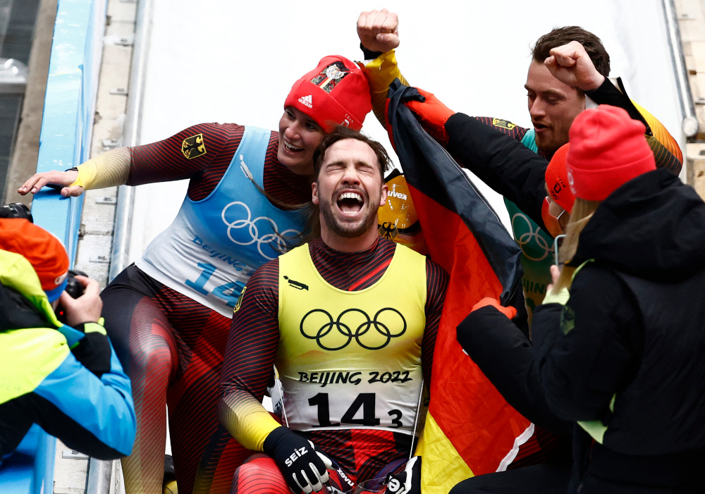 Germanyu00e2u20acu2122s Natalie Geisenberger, Johannes Ludwig, Tobias Wendl and Tobias Arlt celebrate after winning gold at the National Sliding Centre, Beijing, February 10, 2022. u00e2u20acu2022 Reuters pic 