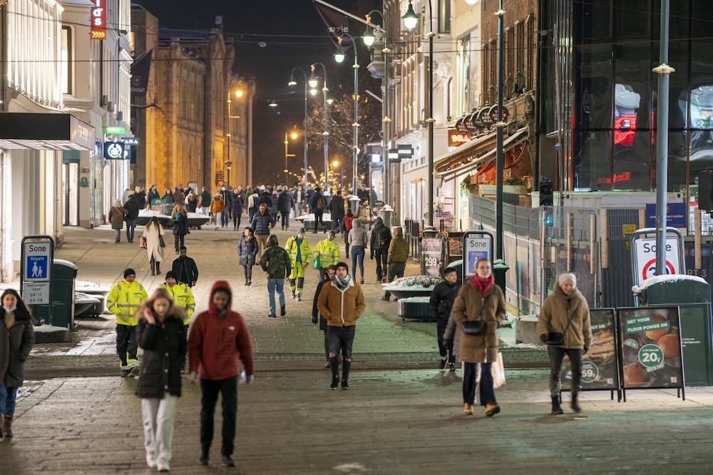 People walk along a pedestrian zone in Oslo on February 2, 2022 as the gastronomy reopens for guests. u00e2u20acu201d AFP pic