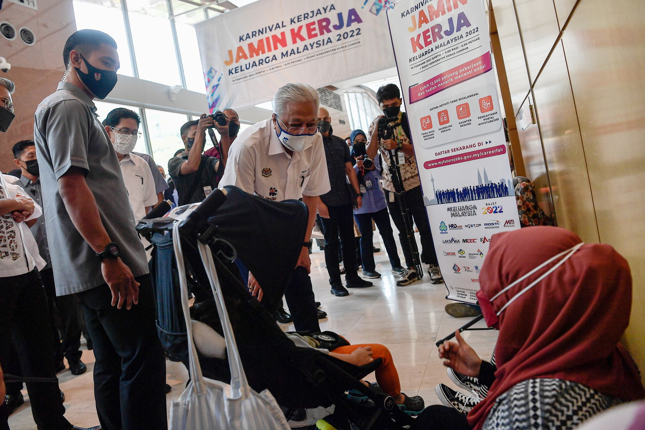 Prime Minister Datuk Seri Ismail Sabri Yaakob greeting people who attended the JaminKerja Keluarga Malaysia Career Carnival 2022 at the Kuala Lumpur Convention Center  February 19, 2022.  u00e2u20acu201d Bernama pic