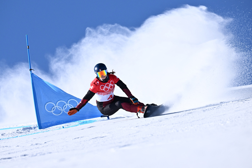 Switzerlandu00e2u20acu2122s Patrizia Kummer competes in the snowboard womenu00e2u20acu2122s parallel giant slalom qualification run during the Beijing 2022 Winter Olympic Games at the Genting Snow Park P & X Stadium in Zhangjiakou, February 8, 2022. u00e2u20acu2022 AFP picnn