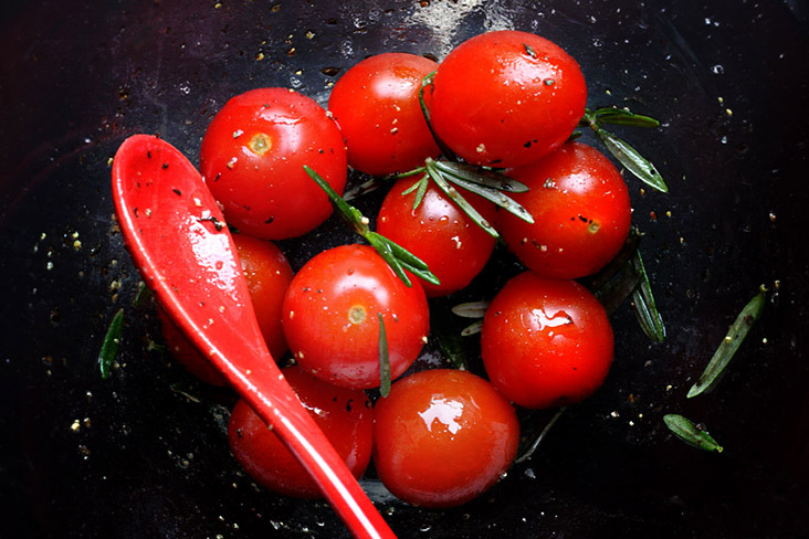 Rosemary and cherry tomatoes add extra flavours to your weekend roast.