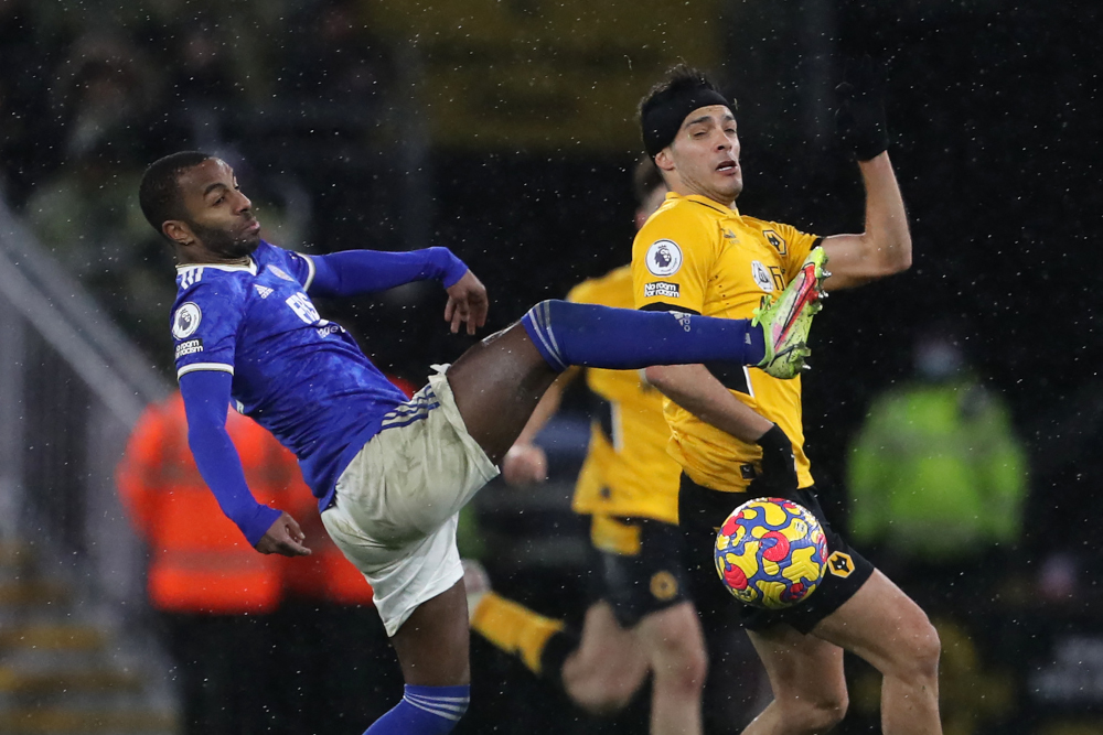 Leicester City defender Ricardo Pereira vies with Wolverhampton Wanderers striker Raul Jimenez during the English Premier League match at the Molineux stadium in Wolverhampton, central England, February 20, 2022. u00e2u20acu201d AFP pic 