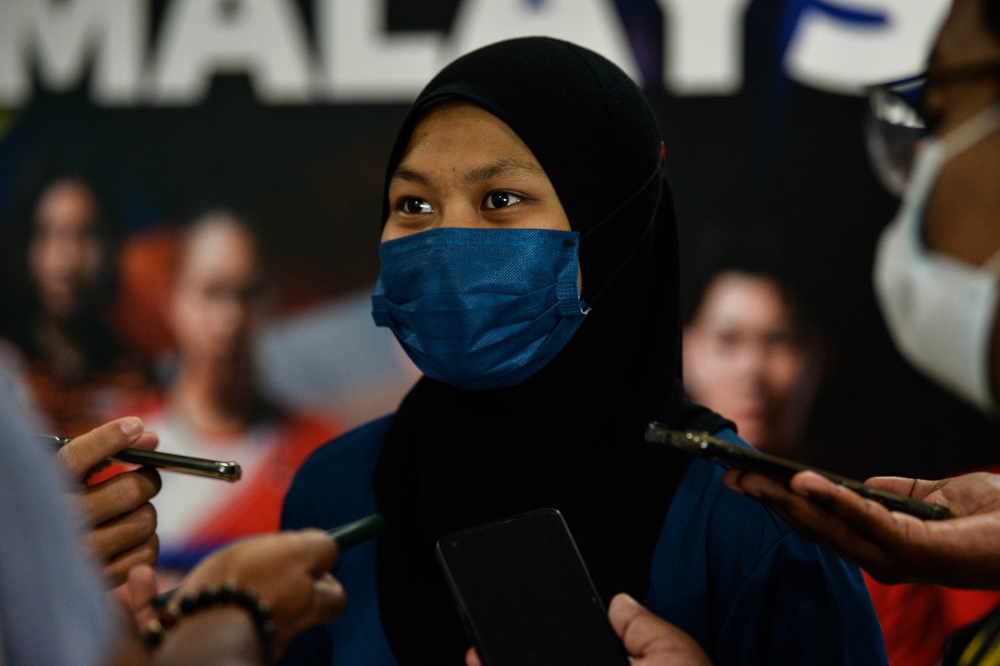 Siti Nurshuhaini Azman speaks to reporters after a training session at the Academy Badminton Malaysia (ABM) in Bukit Kiara, February 8, 2022. u00e2u20acu2022 Bernama pic 