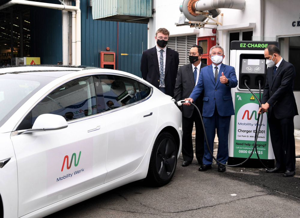 Science, Technology and Innovation Minister Datuk Seri Dr Adham Baba charges an electric vehicle via the Mobility Werk charger during his visit to MW Advantech Sdn Bhd in Shah Alam, February 11, 2022. u00e2u20acu2022 Bernama pic 
