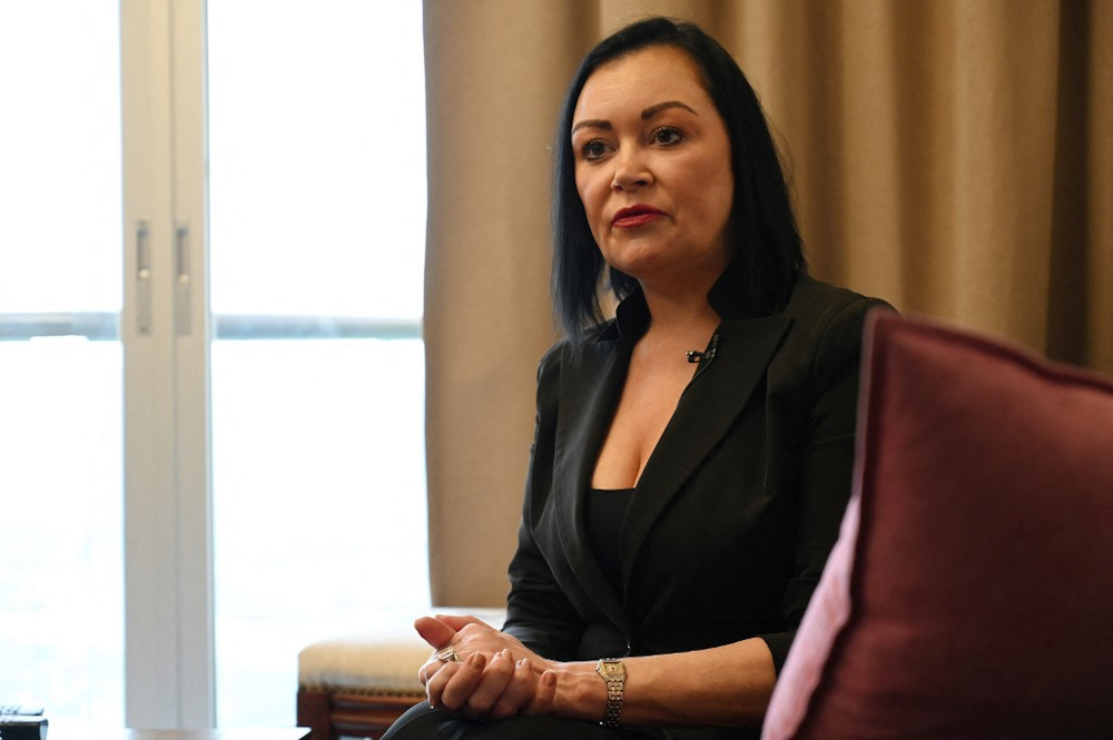 Private aviation company Top Stars Air founder Olga Radlynska, who received dozens of phone calls from frantic pet owners worried about getting their pets out of the city, speaks to AFP at her home in Hong Kong January 25, 2022 .— AFP pic