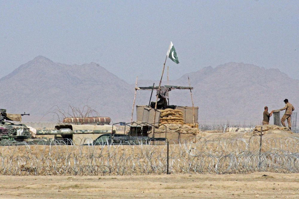 Pakistanu00e2u20acu2122s soldiers stand guard at a checkpoint at the Pakistan-Afghan border in Chaman on February 26, 2022, as hundreds of people were stranded at a key border crossing between Pakistan and Afghanistan. u00e2u20acu201d AFP pic