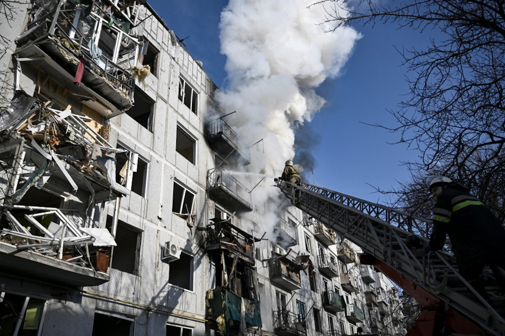Firefighters work on a fire on a building after bombings on the eastern Ukraine town of Chuguiv on February 24, 2022, as Russian armed forces are trying to invade Ukraine from several directions, the border guard service said. u00e2u20acu201d AFP pic