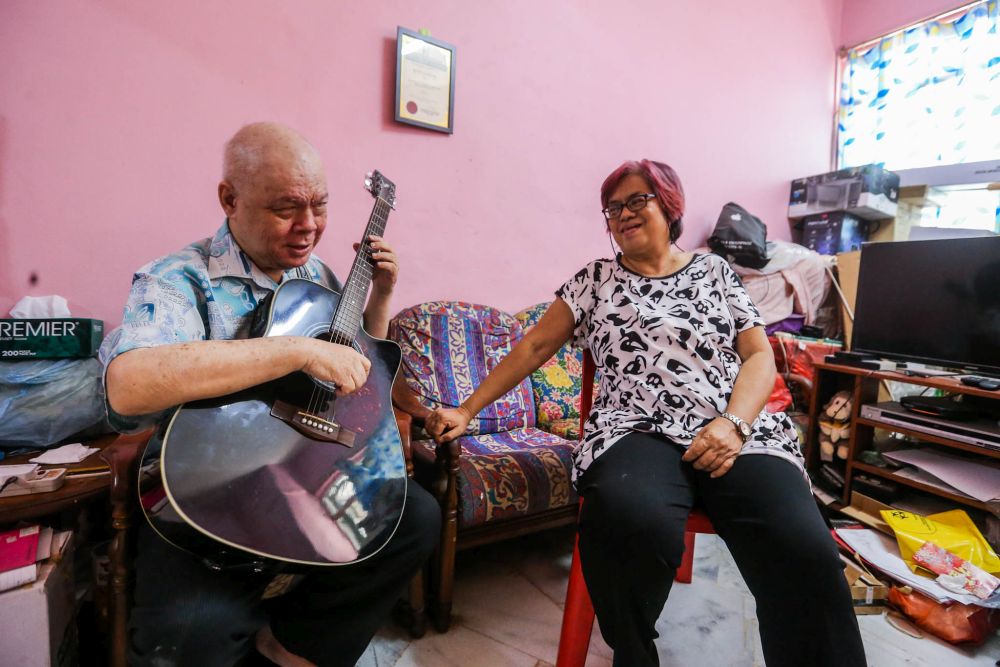 Ho and Baptist at their home in Kuchai Lama, Kuala Lumpur. — Picture by Hari Anggara