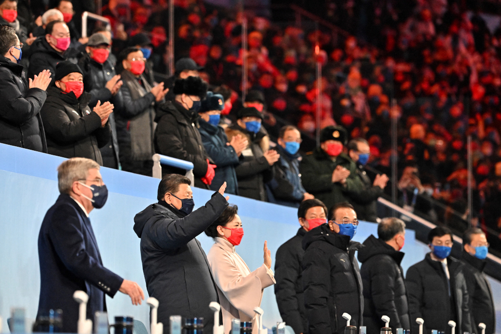 International Olympic Committee (IOC) President Thomas Bach (left), China’s President Xi Jinping (2nd left) and his wife Peng Liyuan (3rd left) waves during the opening ceremony of the Beijing 2022 Winter Olympic Games, at the National Stadium, in Beijing, February 4, 2022. — AFP pic 