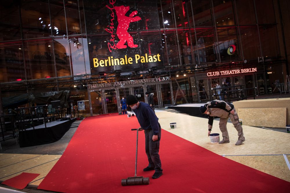 Workers set up the red carpet on February 08, 2022 at the Berlinale Palace in Berlin, prior to the opening of the 72nd Berlinale film festival. u00e2u20acu201d Picture via ETX Studionn