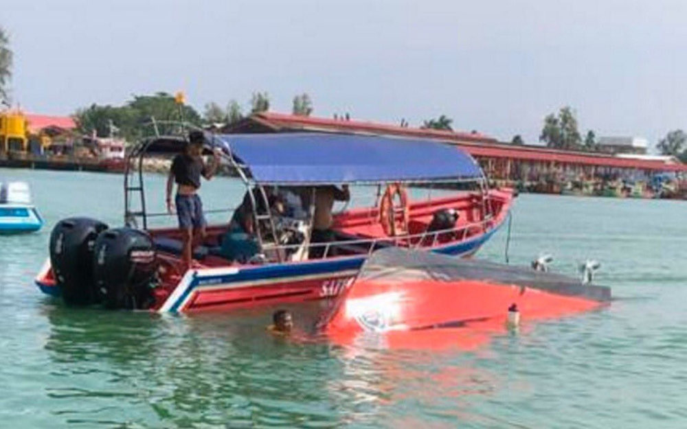 A tourist boat collided with a fishing boat at the Besut River estuary near the Kuala Besut Jetty on January 31, 2022. u00e2u20acu201d Picture via Twitter/Bernama