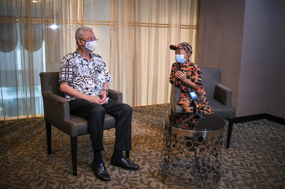 Datuk Seri Ismail Sabri Yaakob speaks during an interview with Muhammad Haziq Mohd Asyraf, 12, in Alor Setar February 6, 2022. u00e2u20acu201d Bernama pic