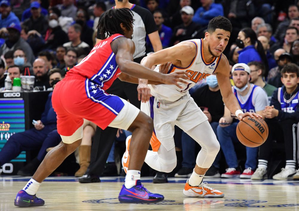 Phoenix Suns guard Devin Booker (right) drives to the basket against Philadelphia 76ers guard Tyrese Maxey during the third quarter at Wells Fargo Centre, Philadelphia February 7, 2022. u00e2u20acu201d Reuters pic