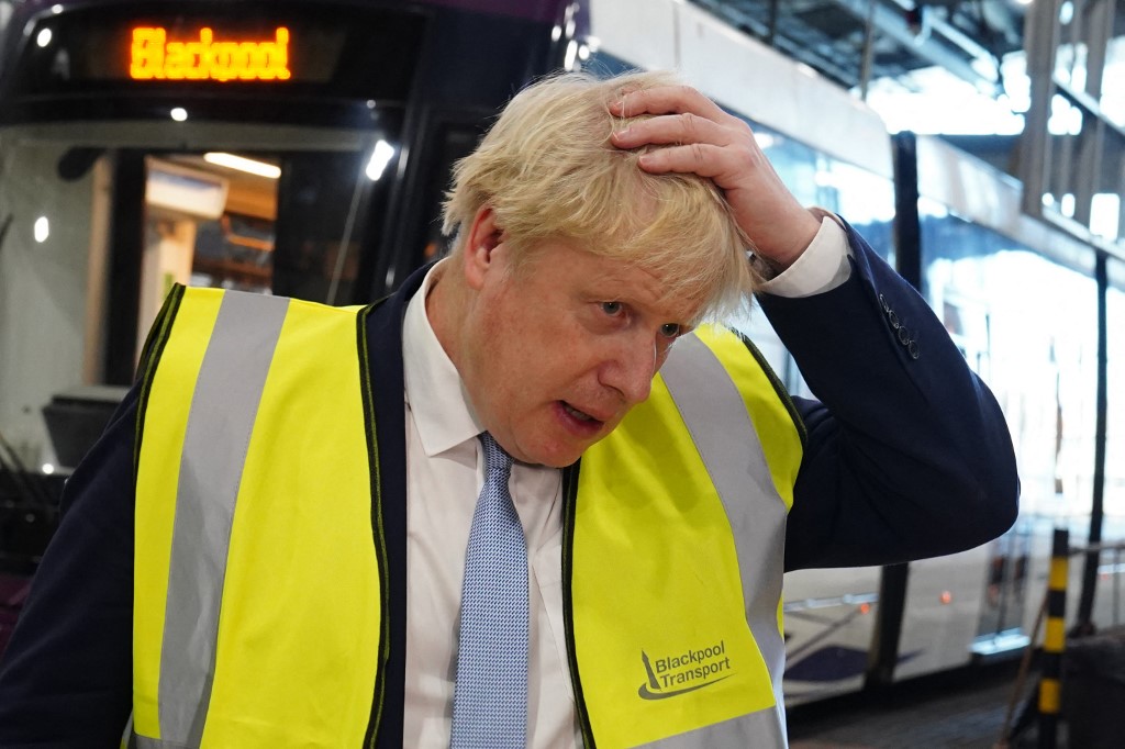 Britains Prime Minister Boris Johnson gestures as he speaks to members of the media during a visit the Blackpool Transport Depot in north-west England on February 3, 2022. u00e2u20acu201d AFP pic