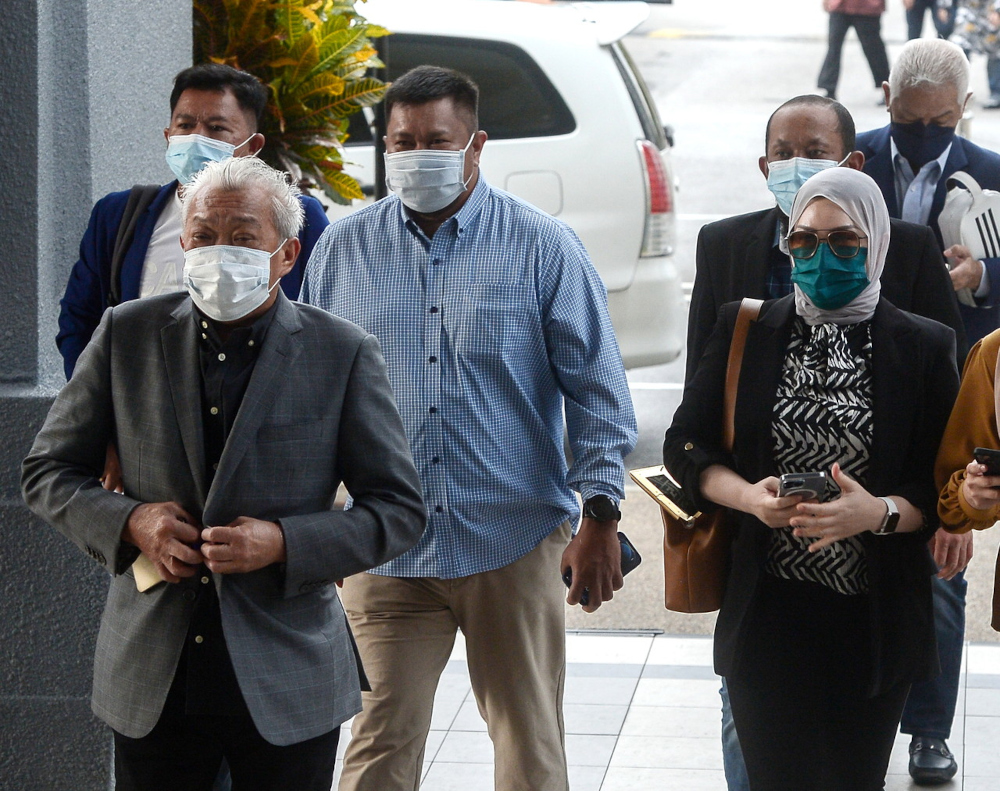 Kinabatangan Member of Parliament Datuk Seri Bung Moktar Radin and his wife Datin Seri Zizie Izette Abdul Samad at the Kuala Lumpur courthouse, January 26, 2022. u00e2u20acu201d Bernama pic 