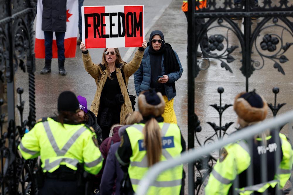 A protestor yells at people leaving Parliament Hill as truckers and supporters continue to protest coronavirus disease (Covid-19) vaccine mandates in Ottawa, Ontario, Canada, February 2, 2022. u00e2u20acu2022 Reuters pic 