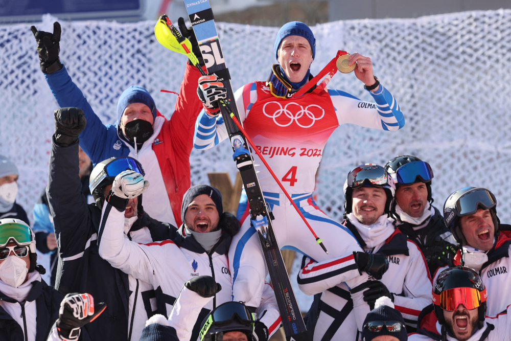 Gold medallist Franceu00e2u20acu2122s Clement Noel (centre, top) celebrates with his team after the menu00e2u20acu2122s slalom victory ceremony at the Yanqing National Alpine Skiing Centre in Yanqing, February 16, 2022. u00e2u20acu201d AFP picnn
