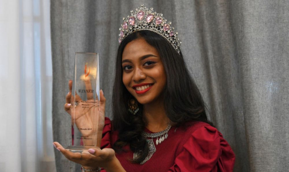 Dheper Reshaa Teh, 19, showing off the Miss Teen International Malaysia 2018/2019 trophy she won, September 26, 2021. u00e2u20acu201d Bernama pic