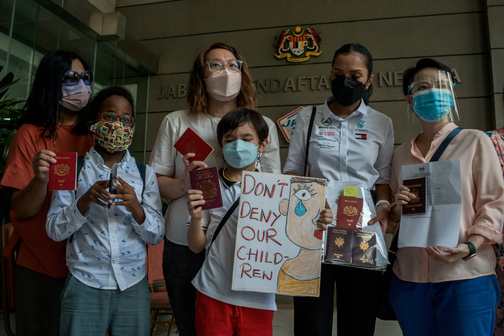 Malaysian mothers with their children who are still waiting for their citizenships to be approved by the National Registration Department in Putrajaya, February 21, 2022. — Picture by Shafwan Zaidon