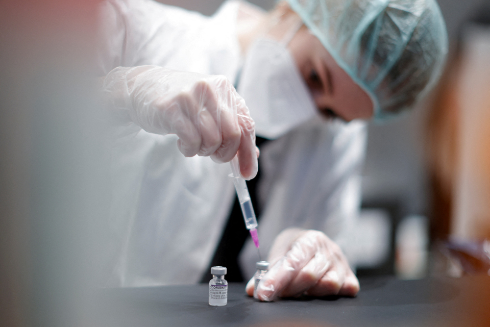 A nurse prepares a shot of Comirnaty Pfizer-BioNTech coronavirus disease (Covid-19) vaccine at the vaccination centre in the Humboldt Forum in Berlin, Germany January 19, 2022. u00e2u20acu201d Reuters pic 