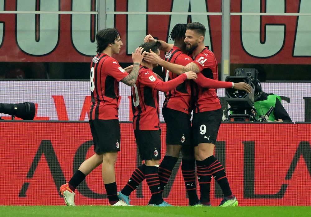 AC Milan's Olivier Giroud (right) celebrates scoring their second goal against Lazio with Rafael Leao and teammates at the San Siro, Milan February 9, 2022. u00e2u20acu201d Reuters pic