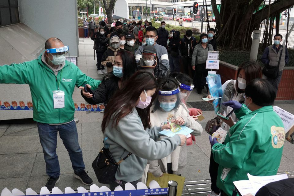 Staff members attend to residents lining up to receive the Sinovac Biotech vaccine against the coronavirus disease (Covid-19), at a community vaccination centre in Sha Tin district of Hong Kong, China February 18, 2022. u00e2u20acu201d Reuters pic