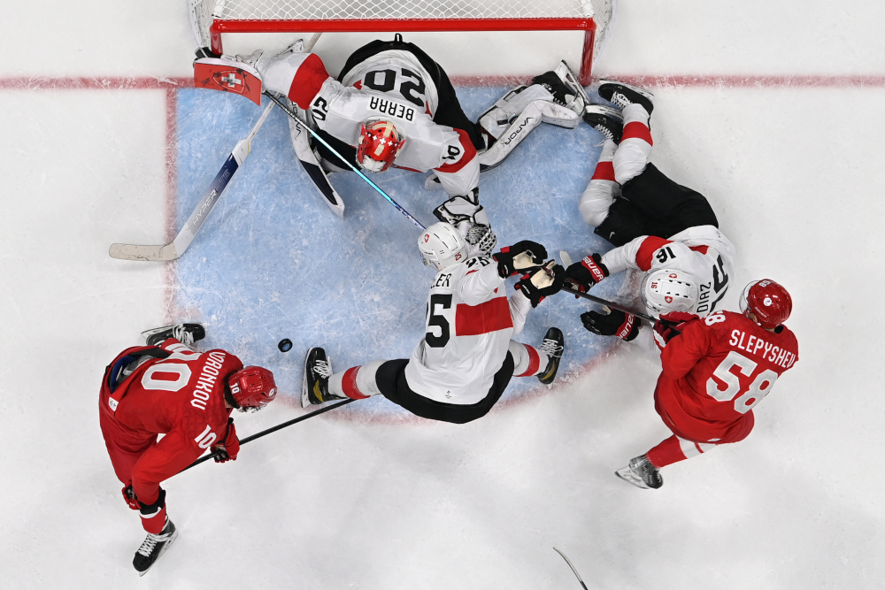 Switzerlandu00e2u20acu2122s goaltender Reto Berra defends his goal during the menu00e2u20acu2122s preliminary round group B match against players of Russiau00e2u20acu2122s Olympic Committee, at the National Indoor Stadium in Beijing, February 9, 2022. u00e2u20acu2022 AFP picnn