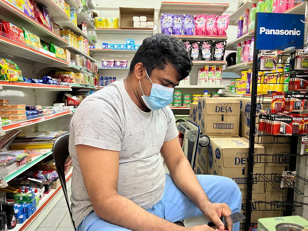 Kedai Runcit Nashi shop assistant V. Ibrahim said the border closure has wiped-out almost 80 per cent of his customers. — Picture by Ben Tan