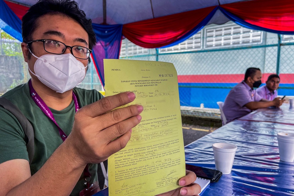 Journalist Weng Kian Yong was fined RM1,000 for violating the standard operating procedure (SOP) at the Larkin nomination centre February 26, 2022. u00e2u20acu2022 Picture by Hari Anggara