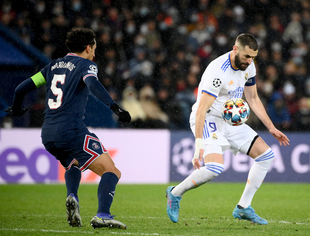Real Madrid forward Karim Benzema controls the ball next to Paris Saint-Germain defender Marquinhos during the Uefa Champions League round of 16 first leg match at the Parc des Princes stadium in Paris, February 15, 2022. u00e2u20acu201d AFP pic 
