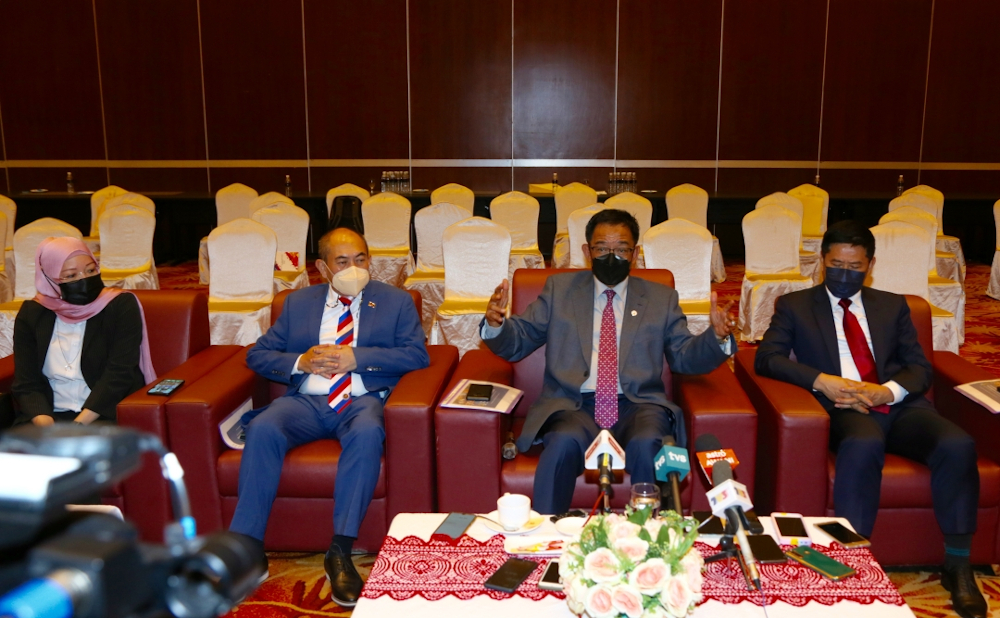Datuk Seri Abdul Karim Rahman Hamzah speaks to reporters while (from left) Nancy Jolhi, Datuk Gerald Rentap Jabu and Ripin Lamat look on. u00e2u20acu201d Muhammad Rais Sanusi/Borneo Post pic