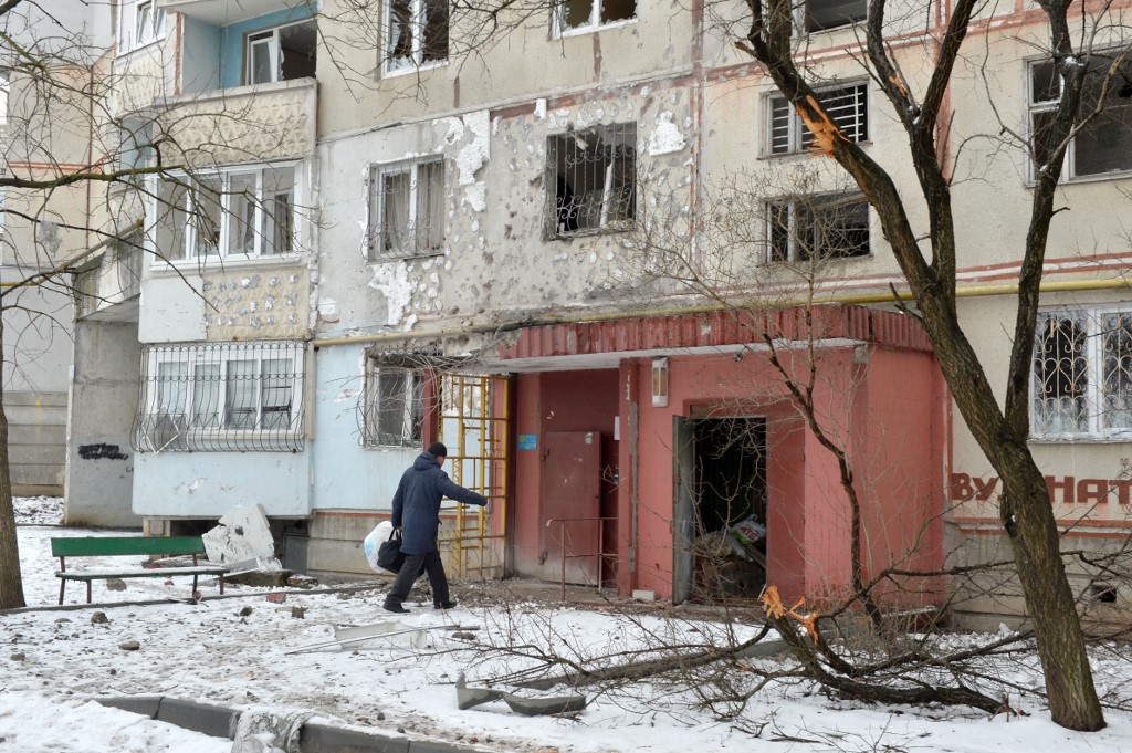 A view of a residential building damaged by recent shelling in Kharkiv on February 26, 2022. Russia on February 26 ordered its troops to advance in Ukraine u00e2u20acu02dcfrom all directionsu00e2u20acu2122 as the Ukrainian capital Kyiv imposed a blanket curfew and officials repo
