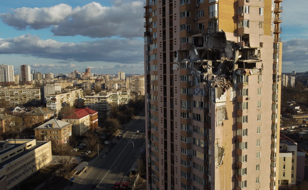 This general view shows damage to the upper floors of a building in Kyiv on February 26, 2022, after it was reportedly struck by a Russian rocket. u00e2u20acu201d AFP pic