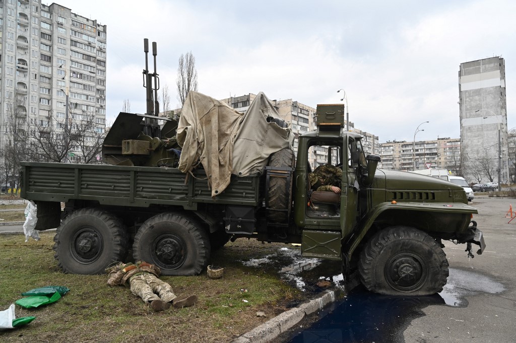 Bodies of Russian servicemen wearing Ukrainian service uniform lie inside and beside a vehicle after they forming a raiding party were shot during a skirmish in the Ukrainian capital of Kyiv on February 25, 2022. u00e2u20acu201d AFP pic
