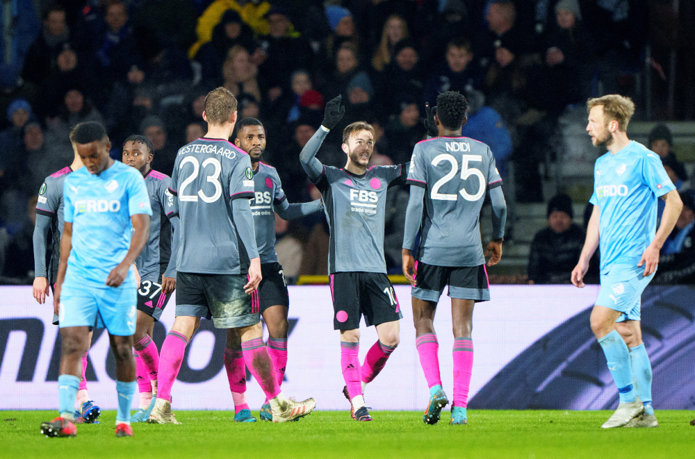 Leicester Cityu00e2u20acu2122s James Maddison celebrates scoring a goal with teammates Bo Amstrup at the Europa Conference League play off second leg match against Randers FC at Randers Stadium, Randers, Denmark, February 24, 2022. u00e2u20acu2022 Ritzau Scanpix pic via Reutersn