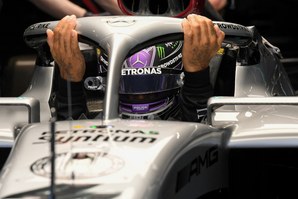 Mercedes driver Lewis Hamilton gets in his car in the pit during the first day of the Formula One (F1) pre-season testing at the Circuit de Barcelona-Catalunya in Montmelo, Barcelona province, February 23, 2022. u00e2u20acu201d AFP pic 