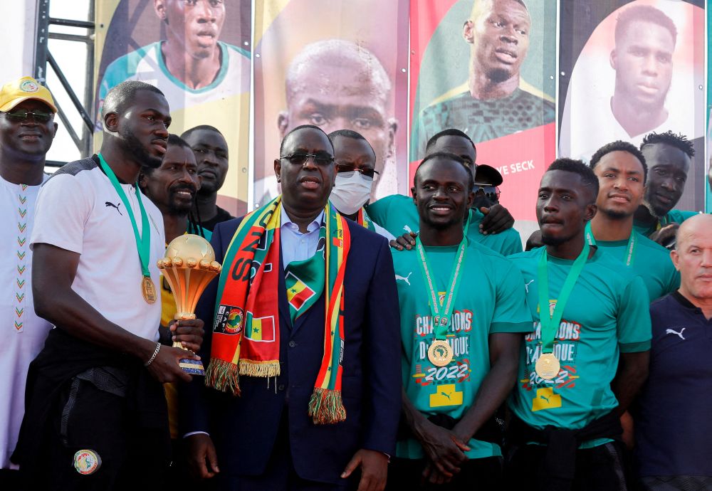 Senegal's President Macky Sall welcomes the Senegal football team after their Africa Cup win at the Leopold Sedar Senghor Airport, in Dakar February 7, 2022. u00e2u20acu201d Reuters pic