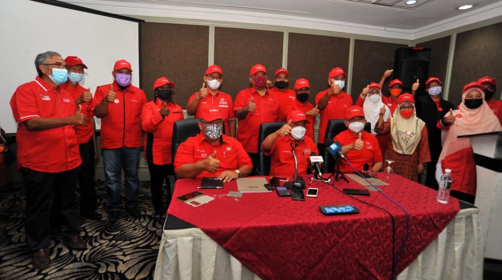 Amanah president Mohamad Sabu (seated, centre) with the partyu00e2u20acu2122s Johor state election candidates at the Thistle Hotel Johor Baru February 18, 2022. u00e2u20acu201d Picture by Ben Tan