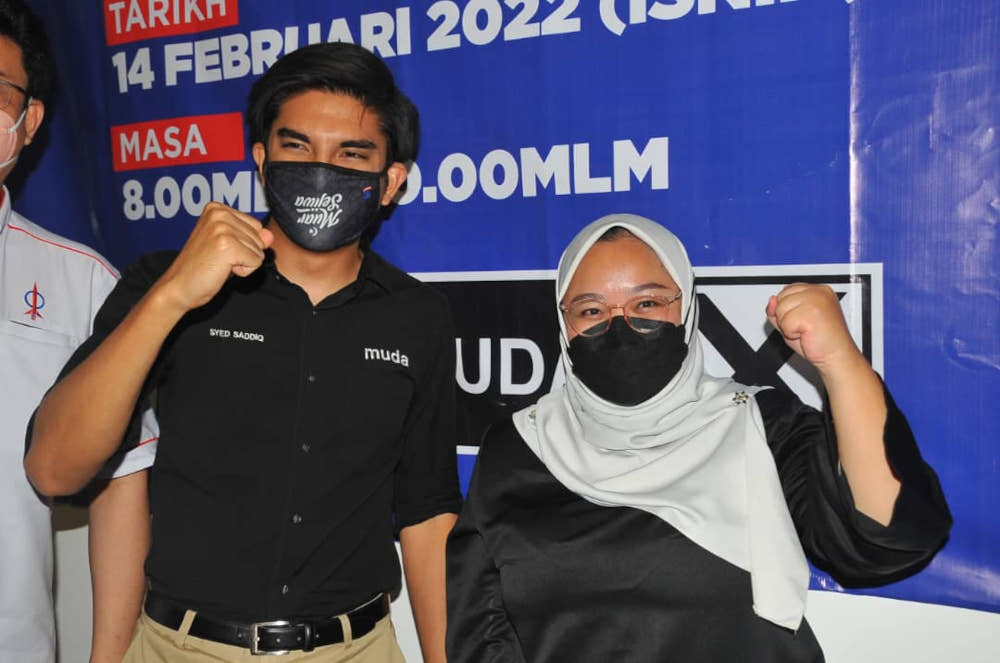 Muda secretary-general Amira Aisya Abd Aziz with party president Syed Saddiq Syed Abdul Rahman in Cascadia Eco Park, Johor Baru, February 14, 2022. u00e2u20acu201d Picture by Ben Tan