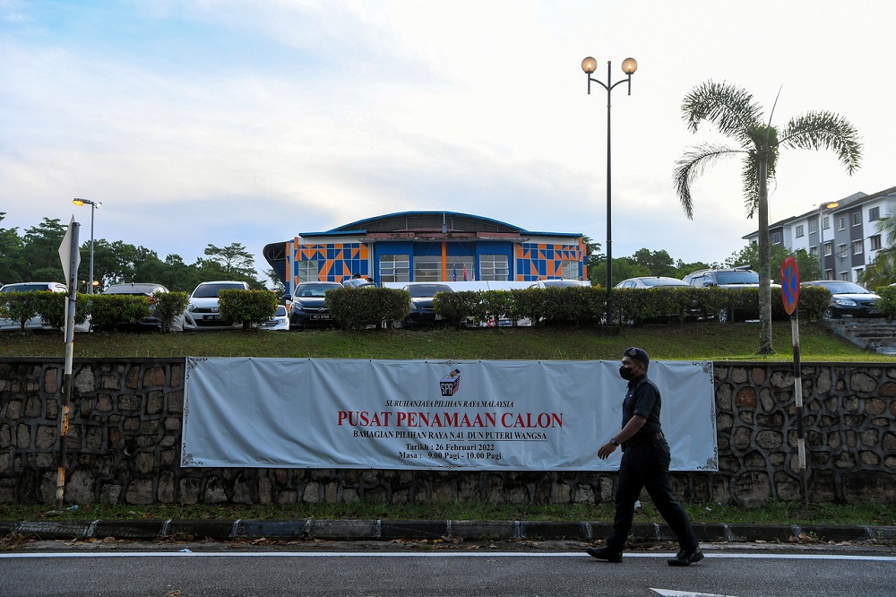 A man walks past a nomination centre in Johor Baru February 26, 2022. u00e2u20acu2022 Bernama pic