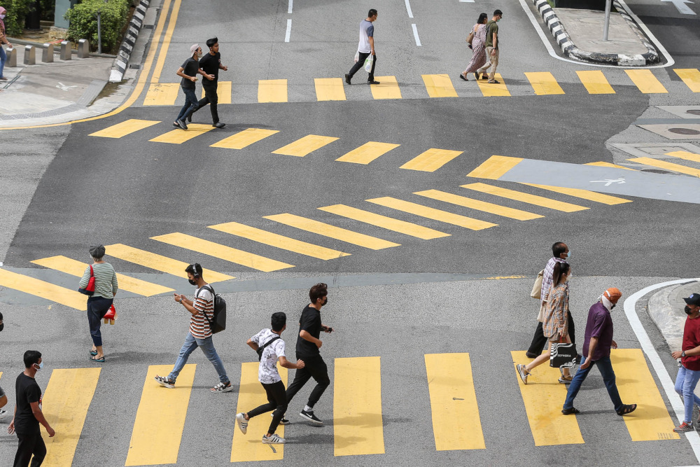 Despite a surge in Covid-19 cases and the spread of the Omicron variant, people continue to throng the Bukit Bintang area, February 9, 2022. u00e2u20acu2022 Picture by Hari Anggara