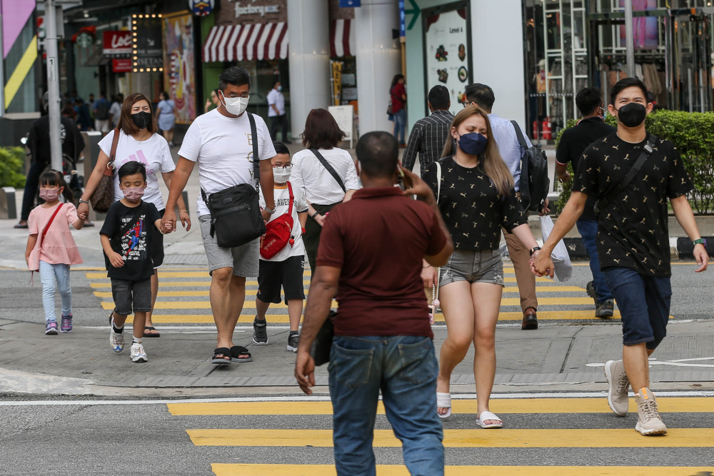 Despite a surge in Covid-19 cases and the spread of the Omicron variant, people continue to throng the Bukit Bintang area, February 9, 2022. u00e2u20acu2022 Picture by Hari Anggara