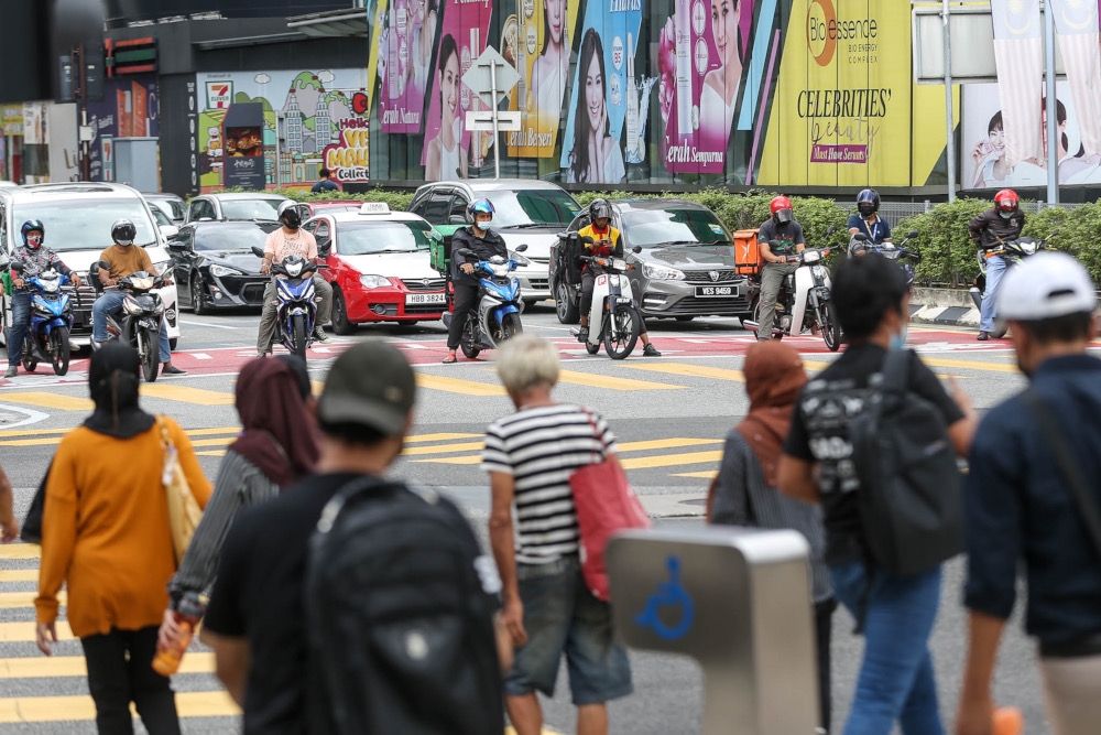 Despite a surge in Covid-19 cases and the spread of the Omicron variant, people continue to throng the Bukit Bintang area, February 9, 2022. u00e2u20acu2022 Picture by Hari Anggara