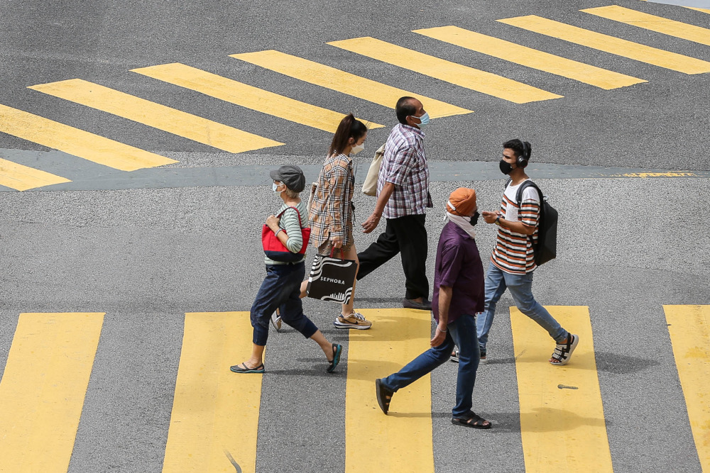 Despite a surge in Covid-19 cases and the spread of the Omicron variant, people continue to throng the Bukit Bintang area, February 9, 2022. u00e2u20acu2022 Picture by Hari Anggara